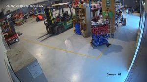 CCTV camera footage inside a warehouse.