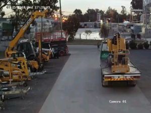 CCTV camera footage of parked heavy equipment and machineries.